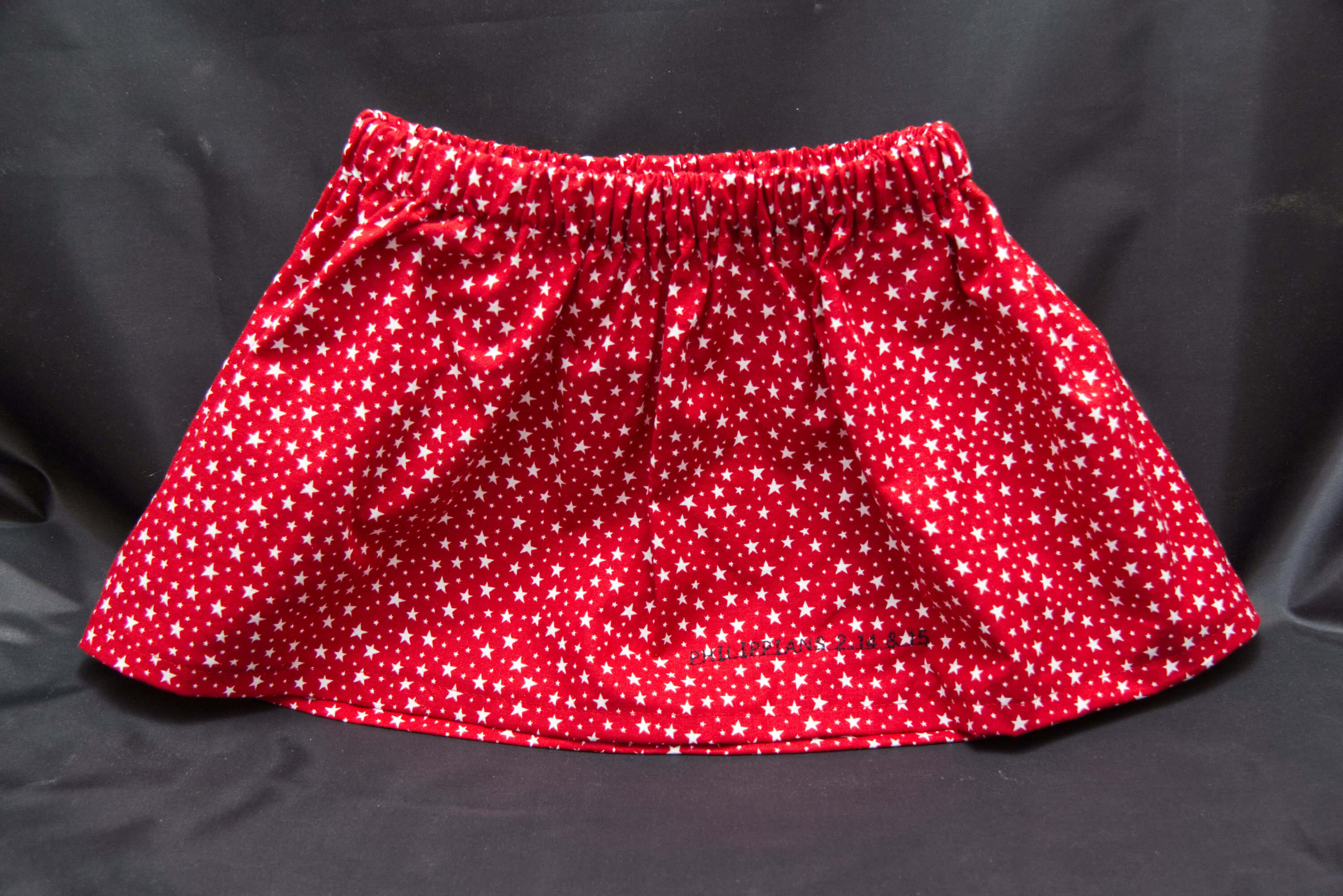 A red skirt with filled with small white stars.